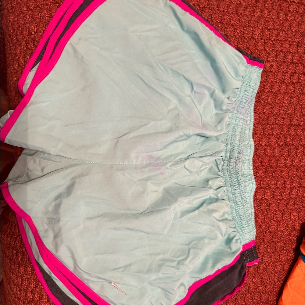 Nike shorts dry fit size M. Small stain on front which is reflected in price.